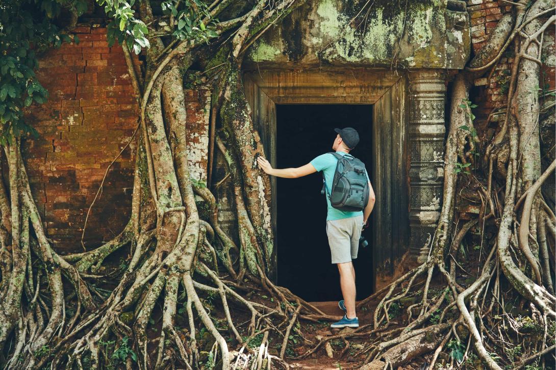 A door leading to a dark room inside the Angkor Wat A Backpack University student exploring the Angkor Wat by stepping through a creepy doorway